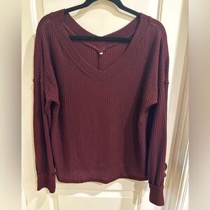 Women’s long sleeve jersey knit v-neck top. Size medium color burgundy